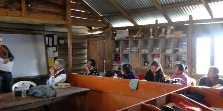 JGCS teachers have a cubicle (not a desk) in a common office with no heat.   The light coming through the  cracks in the rough hand-hewn boards indicate to you how drafty, damp & cold the school can be, especially during  rainy wet  monsoon seasons.